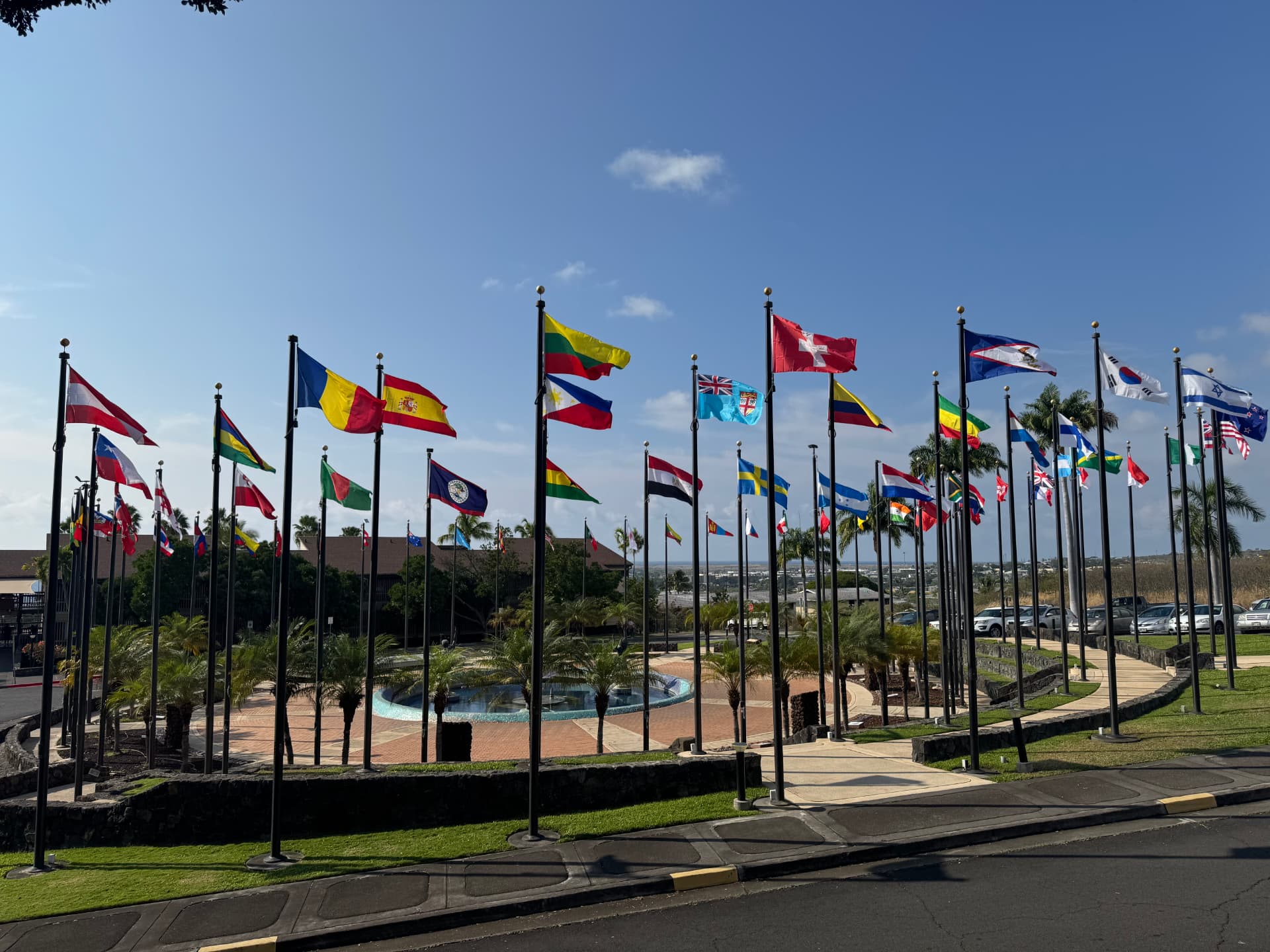 Rows of national flags flying over the YWAM University of the Nations campus in Kona, Hawaii, representing the nations served by the ministry.
