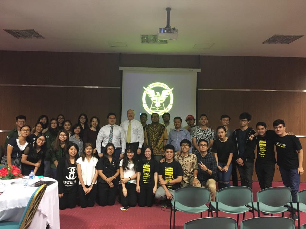 Patrick Talbot with students and members of the Christian Law Students Fellowship after a seminar.
