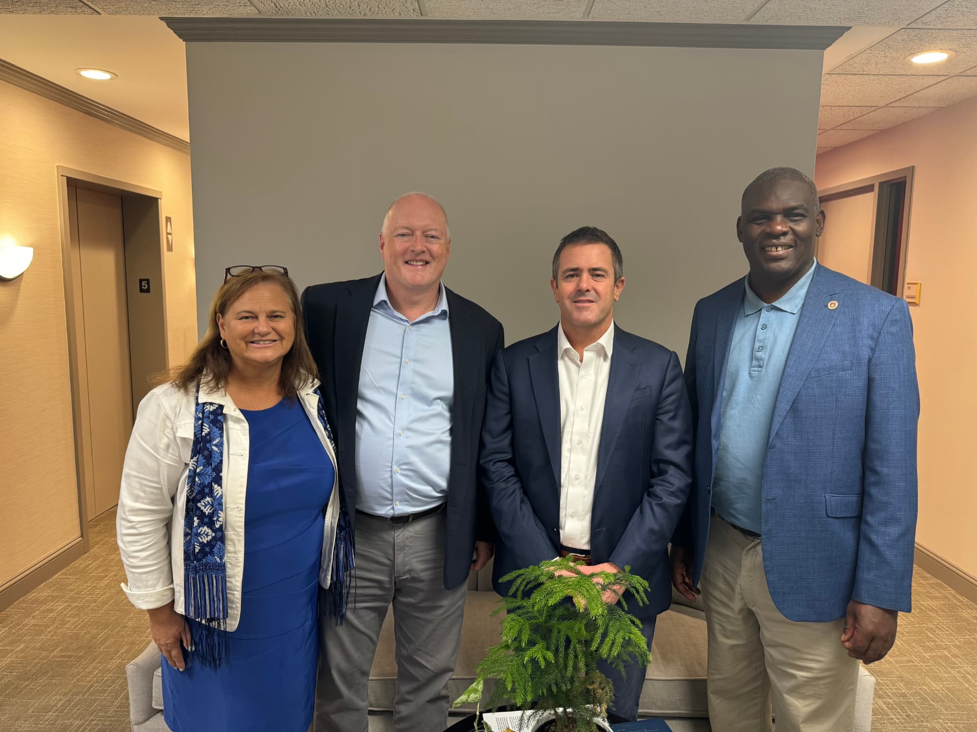 Patrick and Kathleen Talbot with Travis Weber and Supreme Court Justice Mike Chibita of Uganda.